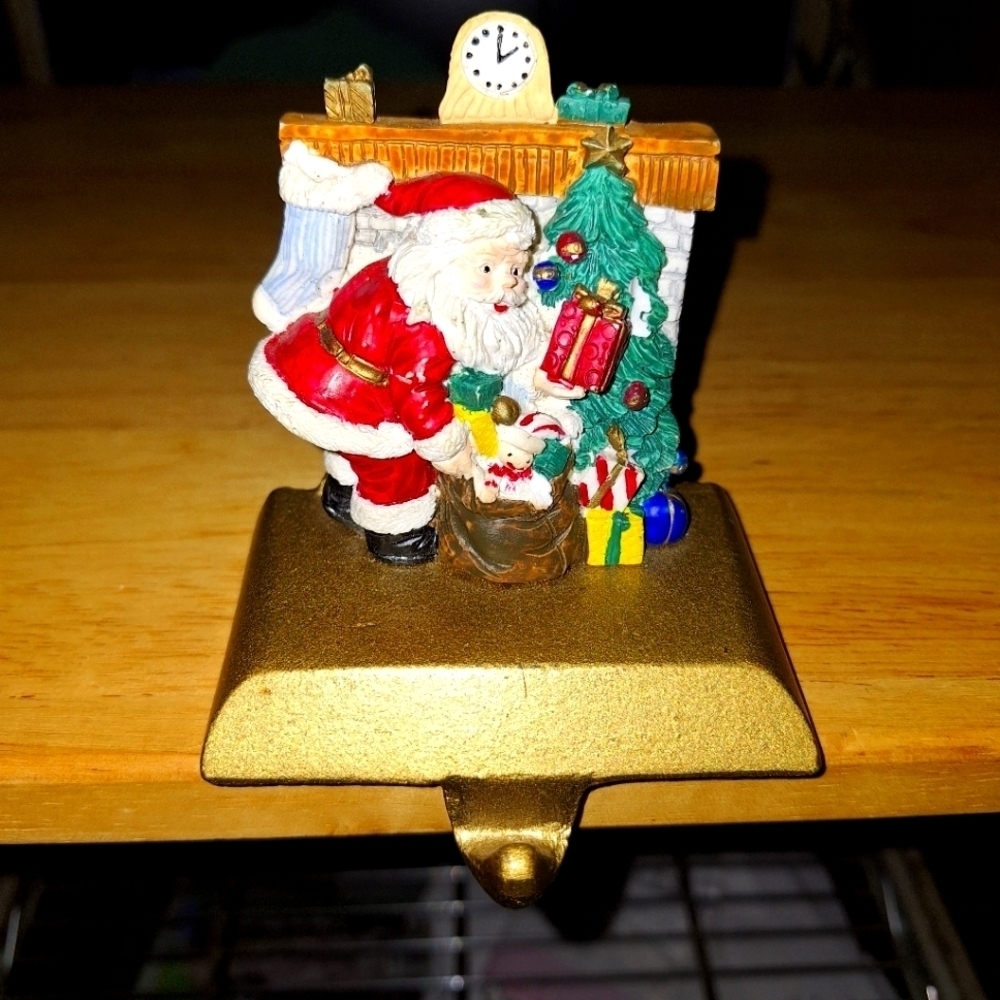 An unbranded Santa Clause Stocking Holder. Its base is 3.75"x2.5" and 3.75" tall